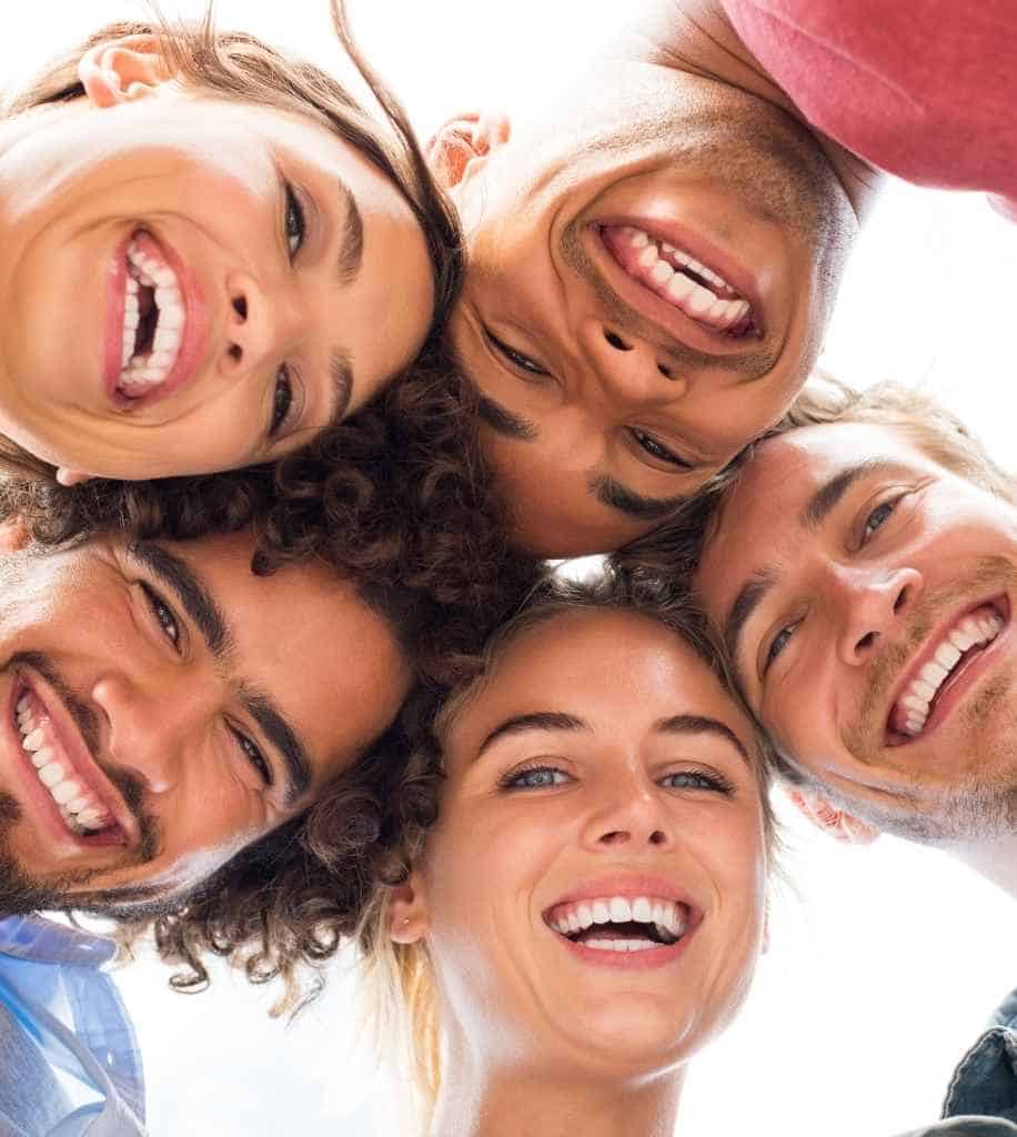 Smiling person showcasing white teeth after laser whitening treatment Newport